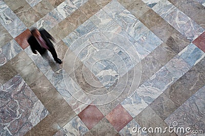 Person walking on tiled floor Stock Photo