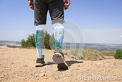 Person walks using glass legs in which fishes swims Stock Photo
