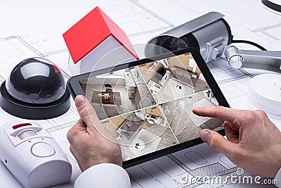 Person Watching Footage On Digital Tablet Stock Photo