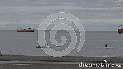 Slow Motion Waterskiing Adventure Near Beach With Birds Stock Photo