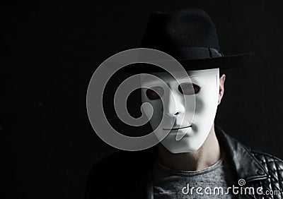 Person wearing white mask anonymous Stock Photo