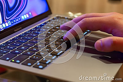 person working on the laptop and typing Editorial Stock Photo