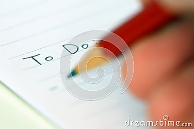 Person writing to do list Stock Photo