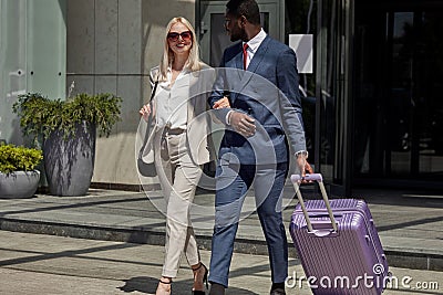 Personal bellboy accompanies the client, helps with luggage Stock Photo