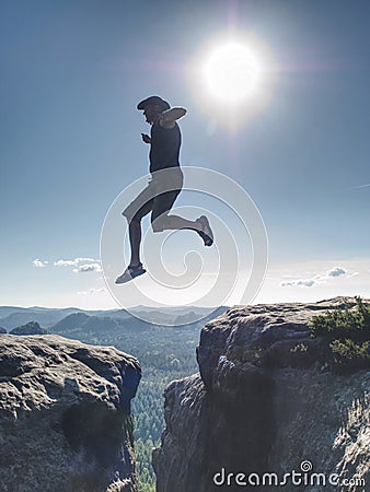 Personal challenge, risk and freedom. Crazy man jumping over Stock Photo