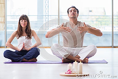 The personal coach helping during yoga session Stock Photo