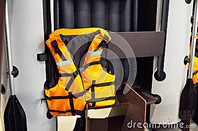 Personal flotation device as life jacket and boat in store Stock Photo