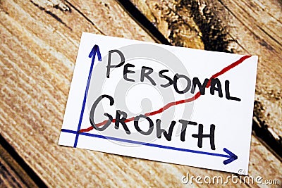 Personal growth - handwriting in a black ink on wooden background concept for personal development Stock Photo