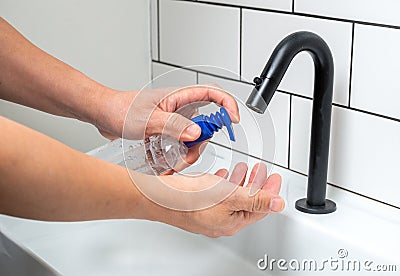 Personal hygiene: applying disinfectant hand gel Stock Photo