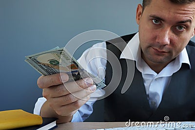 Personal loan concept. Man offers money in the office Stock Photo