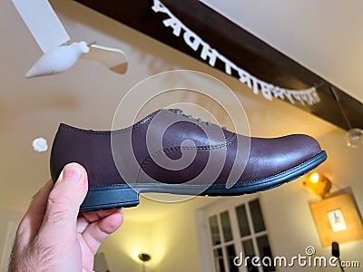 Personal perspective looking at the new brand modern Camper leather shoes - Editorial Stock Photo