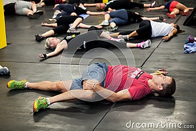 Personal Trainer giving fitness instruction at a Crossfit group class Editorial Stock Photo