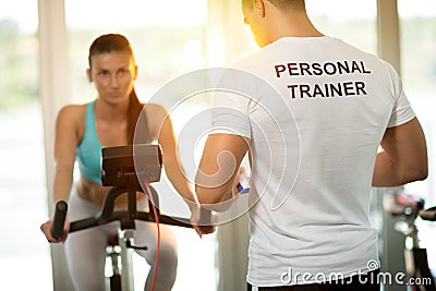 Personal trainer at the gym Stock Photo