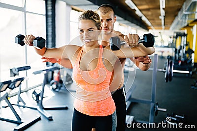 Personal trainer helping Stock Photo