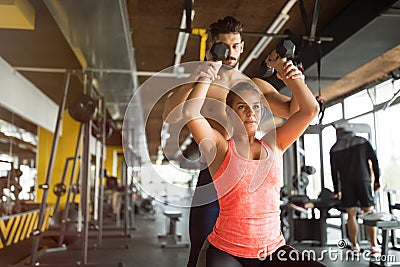 Personal trainer helping Stock Photo