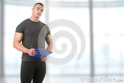 Personal Trainer Holding a Pad Stock Photo