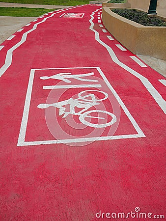 Perspective of Bicycle and pedestrian lane, track painted in red color and white line graphic sign, footpath, symbolic, sidewalk Stock Photo