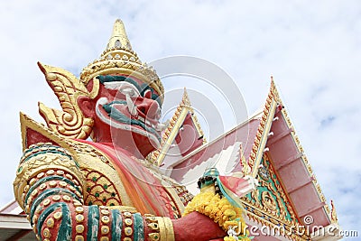 Perspective of Giant with white temple on sky background Stock Photo