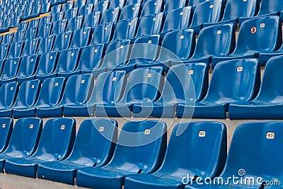 Perspective of many empty stadium seats Stock Photo