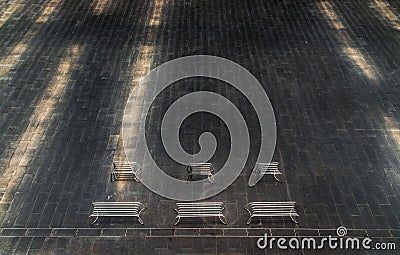 Perspective outdoor white metal benchs in open empty space area of the park Stock Photo