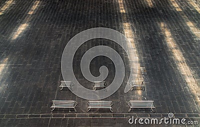 Perspective outdoor white metal benchs in open empty space area of the park Stock Photo