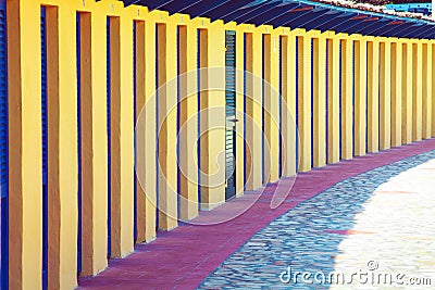 Perspective of repeated cabins for beach holidays. Long row of concrete cabins to allow vacationers to change or place objects. Stock Photo