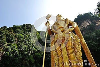 Perspective shot of Statue of Hindu God, Lord Murugan in Batu Caves, Kuala Lumpur, Stock Photo