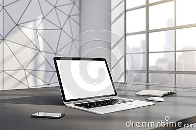 Perspective view on blank white modern laptop screen with place for your logo or text on table in sunlit modern interior Editorial Stock Photo
