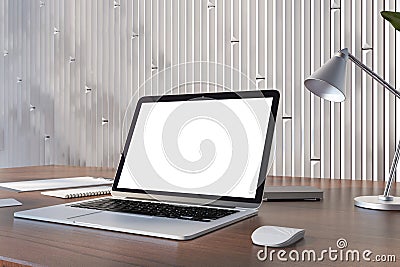 Perspective view on blank white modern laptop screen with space for your logo or text on wooden table with notebooks and lamp on Editorial Stock Photo