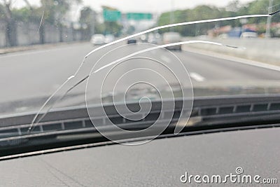 Perspective view of cracked car windscreen or windshield while d Stock Photo