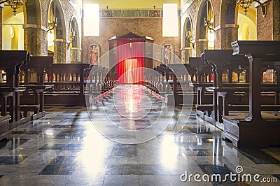 Italian church interior view, with sun rays lighting effects. Color image Editorial Stock Photo