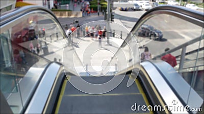 Perspective view thru escalator, defocused unrecognizable group of people on road intersection crosswalk on Strip of Las Vegas, Stock Photo