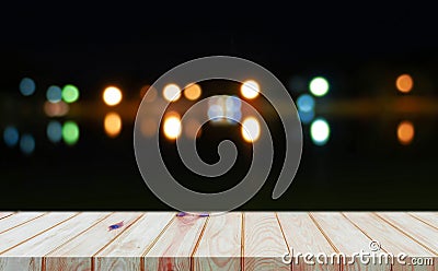 Perspective wooden board over bokeh light at night Stock Photo