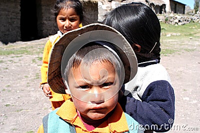 Ayacucho children in a poor school entering the classrooms with their teacher Editorial Stock Photo