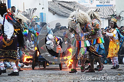 Peru Paucartambo guerrilla fight between SAGRAS and demons and devils with angels masks and the people June 2019 Editorial Stock Photo