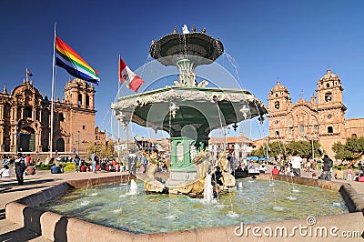 View of Plaza de Armas with Inca fountain, Cathedral and Compania de Jesus Church in Cusco, Peru Editorial Stock Photo