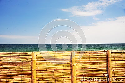 Peru bamboo fence without people with blue sky and sea peaceful rural scene Stock Photo