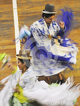 Puno woman dancing with her typical colorful clothes during a musical show at La Vigen de la Candelaria carnival Editorial Stock Photo