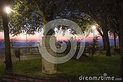 Statue dedicated to Pintoricchio at Perugia Piazza Italia`s garden at sunset time Stock Photo