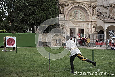 javelin throwers in medieval costumes on the streets of Perugia's historic center during the event , Perugia 1416 Editorial Stock Photo