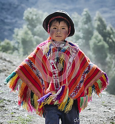 Peruvian boy dressed in colourful traditional handmade outfit Editorial Stock Photo