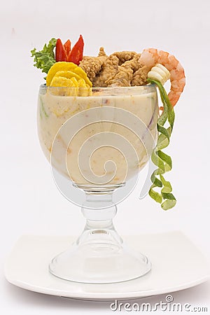 Peruvian dish: Ceviche called Leche de Tigre Caretilero . Fresh cebiche with fried fish. Stock Photo