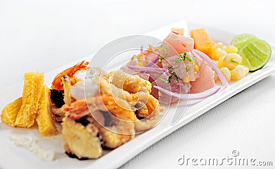 Peruvian food: chicharrones de pescado with ceviche cebiche . Stock Photo