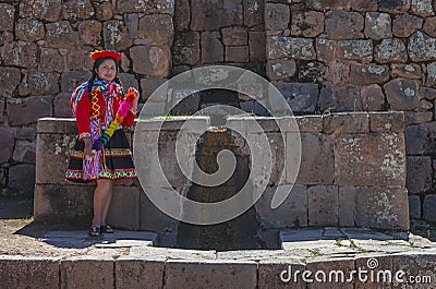 Peruvian Indigenous Woman by a Fountain, Cusco Editorial Stock Photo