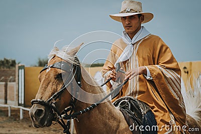 Peruvian Morochuco cowboy on horse Editorial Stock Photo