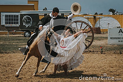 Peruvian woman dancing with cowboy Editorial Stock Photo