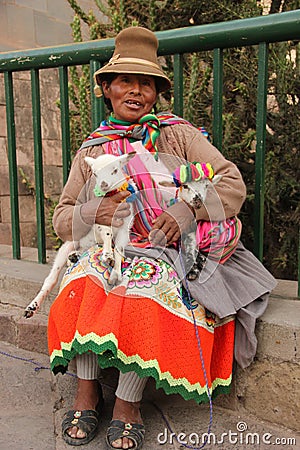 A Peruvian woman and her goats Editorial Stock Photo