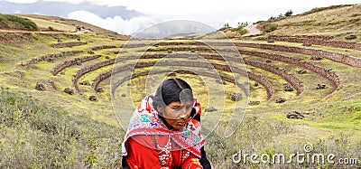 Peruvian woman and Moray inca ruins Editorial Stock Photo