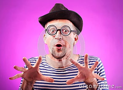 Pervert nerd in hat touches imaginary boobs Stock Photo