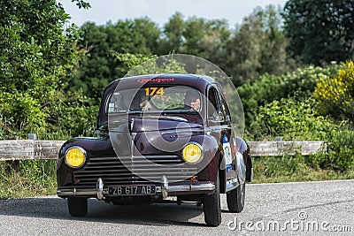 PESARO COLLE SAN BARTOLO, ITALY - MAY 17 - 2018: PEUGEOT 203 1949 old racing car in Mille Miglia rally 2018 the famous italian his Editorial Stock Photo